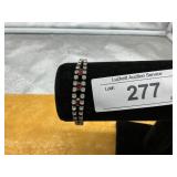 BRACELET WITH RED STONES