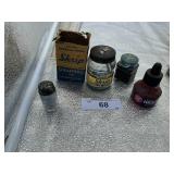 DIFFERENT BOTTLES OF INK