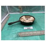 SMALL CAST IRON SKILLET WITH MELT CANDLE IN IT,