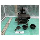 SAMPLE QUEEN CAST IRON STOVE W/