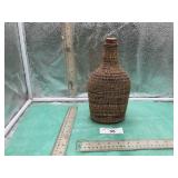 BASKET WEAVER AROUND A BOTTLE APPROX SIZE