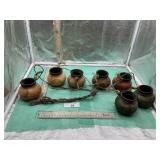 7) SMALL POTTERY CONNECTED WITH JUTE STRING TO