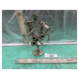COWBOY RIDING HORSE MADE OUT OF NUTS AND BOLTS,