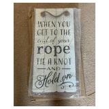 Ropes end hold on sign