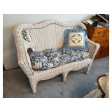 Vintage wicker loveseat with blue cushion