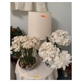 Lamp & floral ontop of table