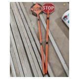 2 slow/stop signal signs