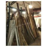 Lot of lumber - contents leaning behind rack
