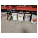 Assorted buckets under rack