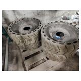 4 skid steer wheels and tires