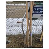 2 post hole diggers and shithe