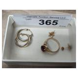 Gold earrings and marked ring