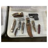 9 knives and starting pistol