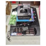 Dart board, pool balls, training mask