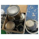Empty paint cans and lids