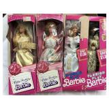 4 Assorted Barbie Dolls