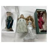 4 Porcelain Dolls - one Chipped neck