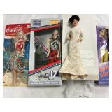 4 Assorted Dolls