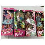4 Assorted Barbie Dolls