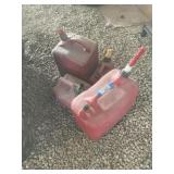 4 gas containers, some Liquid in them