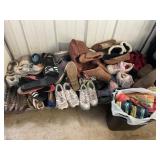 Bottom shelf of shoes, different sizes