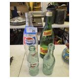 4 old pop bottles