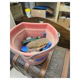 Bucket and horse brushes