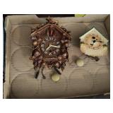 2 small wall clocks