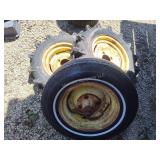 3 John Deere machine wheels