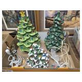 3 lighted Christmas trees