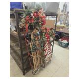 2 Christmas decorated sleds