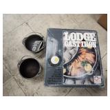 Cast iron dutch oven and 2 small pots