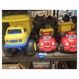 3 plastic trucks