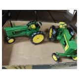 2 John Deere die cast tractors