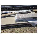 Assorted trim, siding and metal patio door frame