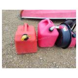 3 gas cans and oil pan