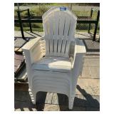 6 white Adirondack plastic chairs
