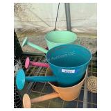 4 watering can planters