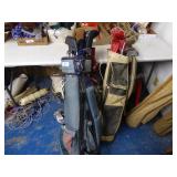 2 golf bags and clubs