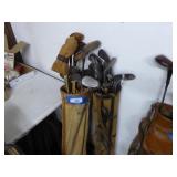 2 golf bags and clubs (most wood shafts)