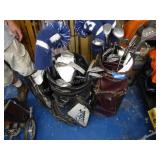 2 golf bags w/ clubs