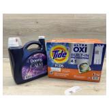 Case of tide pods and jug of downy