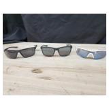2 pairs of Nike sunglasses 1 pair of Under Armour