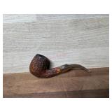 Carved bowl pipe with tan acrylic stem