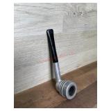 Unmarked metal pipe with black stem