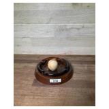 Amber ashtray on wood stand