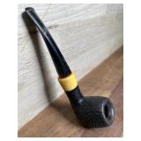 Black carved bowl pipe with vulcanite stem