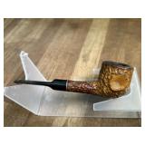 Woodie marked carved pipe with black stem
