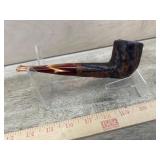 Carved pipe with red acrylic stem