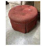 Round red upholstered ottoman